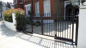 residential black bi-fold gate
