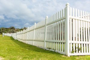 white fencing in green field