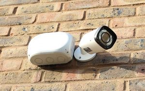fire and security systems cctv camera installed on brick wall