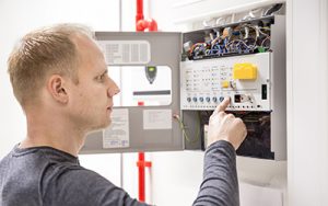 fire and security systems man with control box